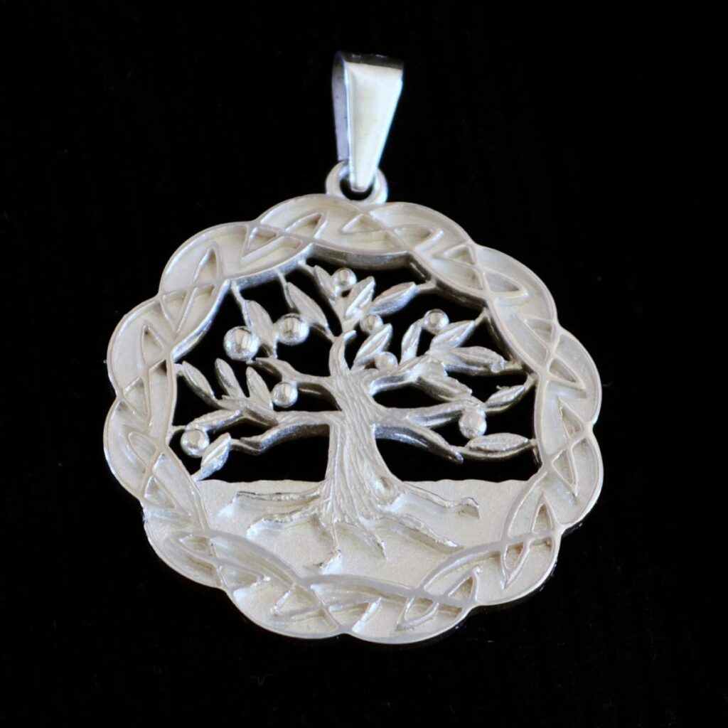 Handcrafted Tree of Life pendant in sterling silver by Alice Walker featuring a Celtic knot border.