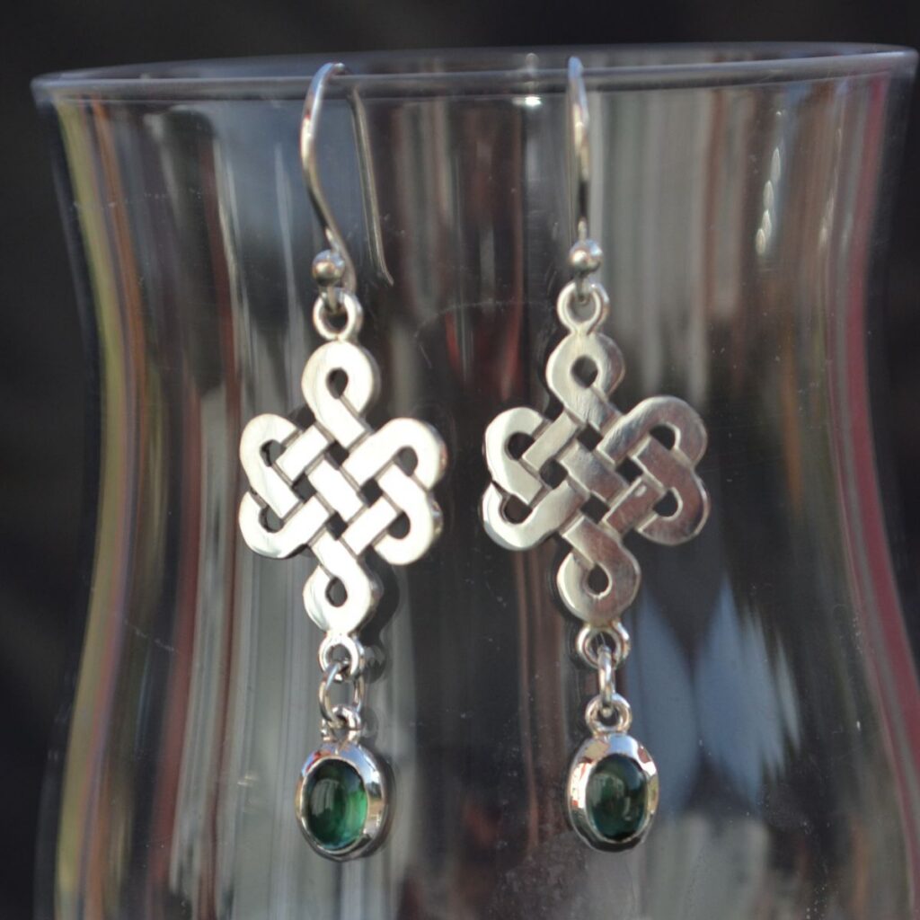 Handcrafted sterling silver Endless Knot earrings with natural green tourmalines by Alice Walker Goldsmith