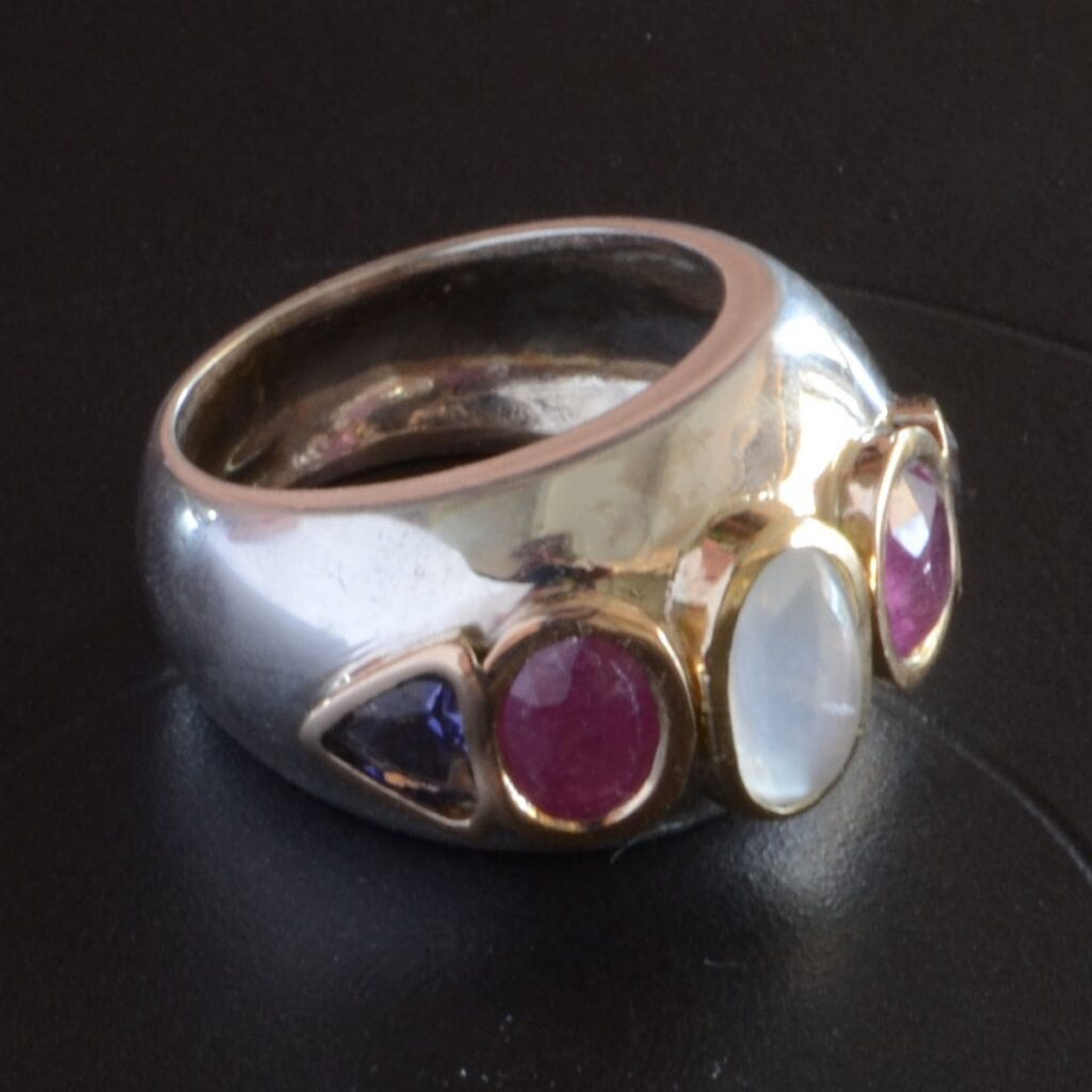 Handcrafted sterling silver and gold ring featuring natural moonstone, ruby and iolite by Alice Walker Goldsmith